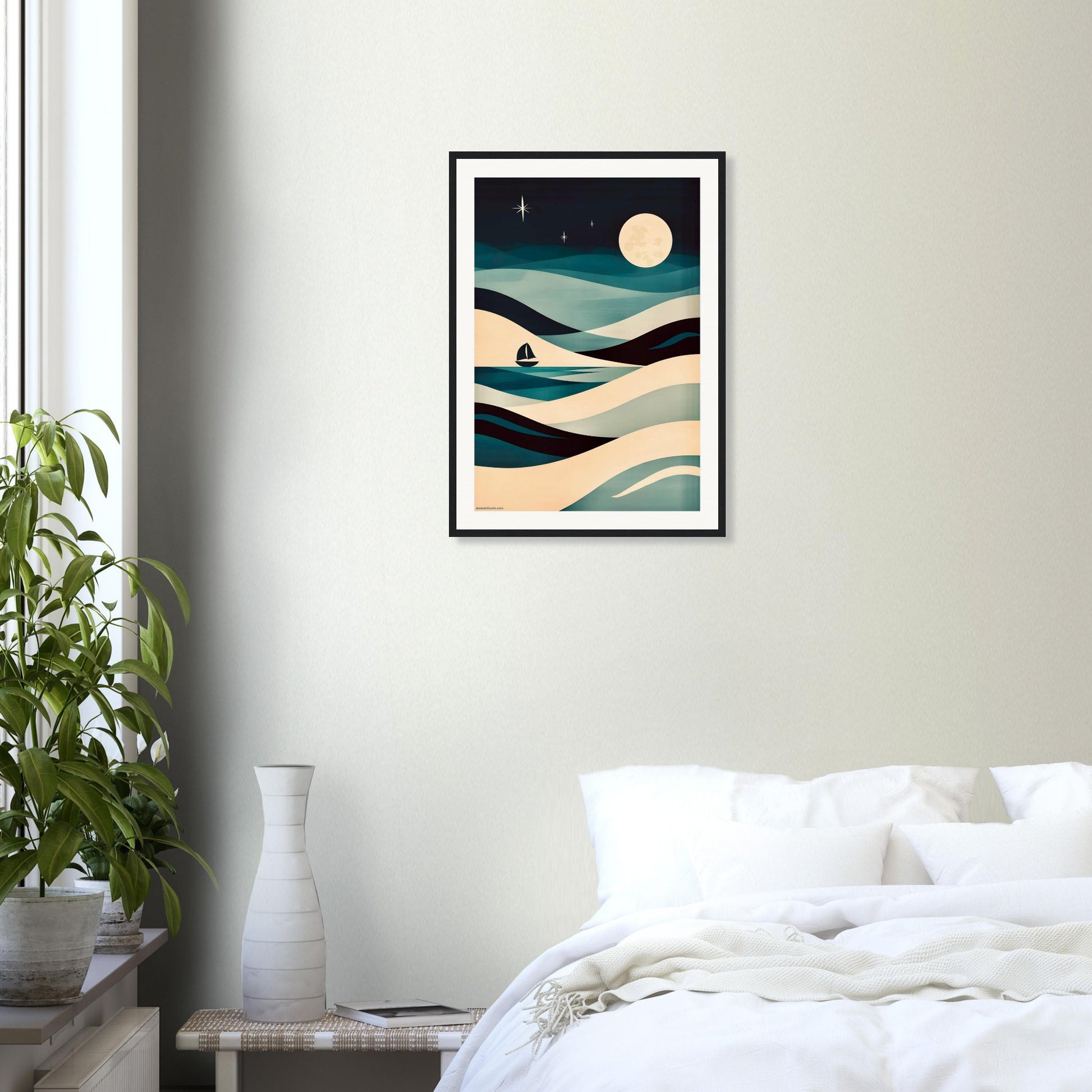 Framed abstract seascape art with calming teal and beige palette on a wall above a bed in a bedroom.