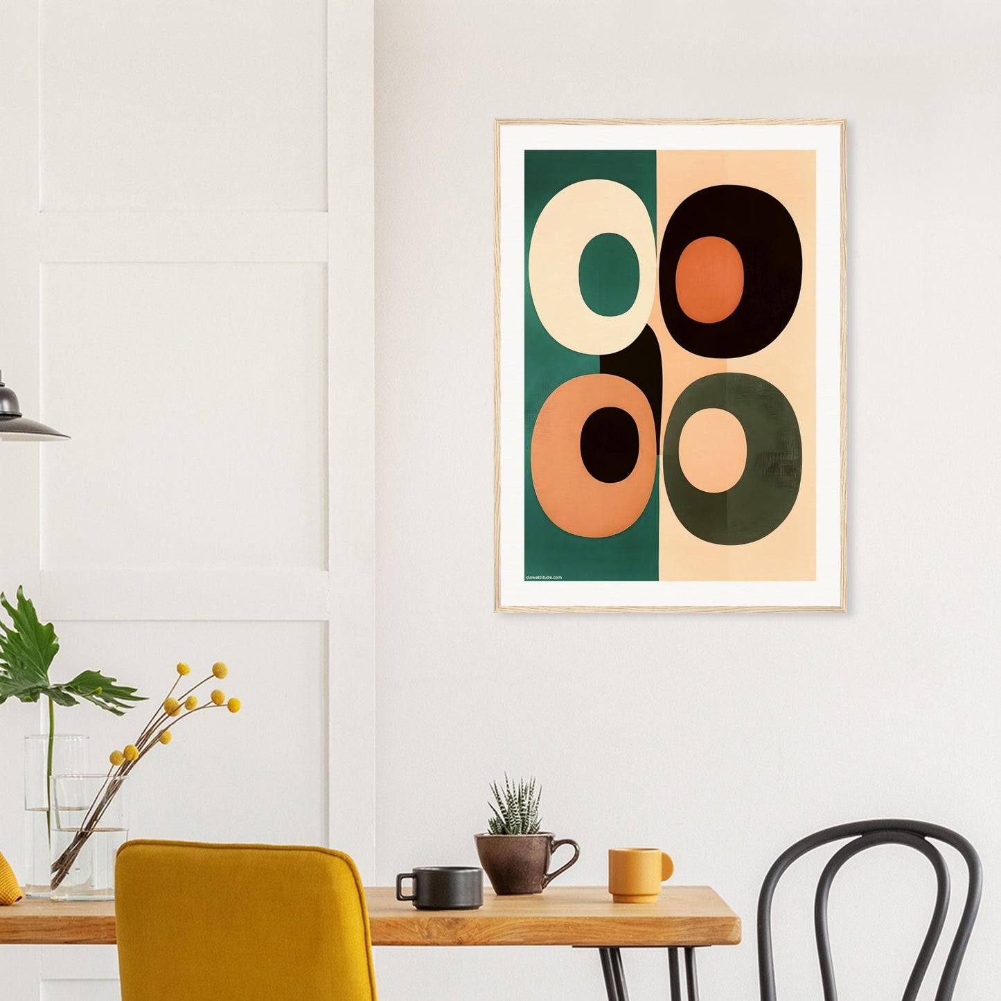 Abstract art print with geometric shapes in a modern interior setting.
