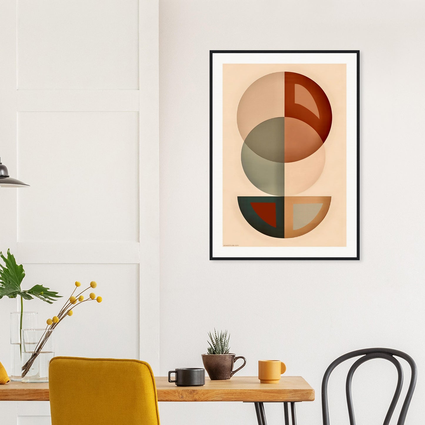 Abstract geometric earth tones framed poster in modern living room with neutral decor