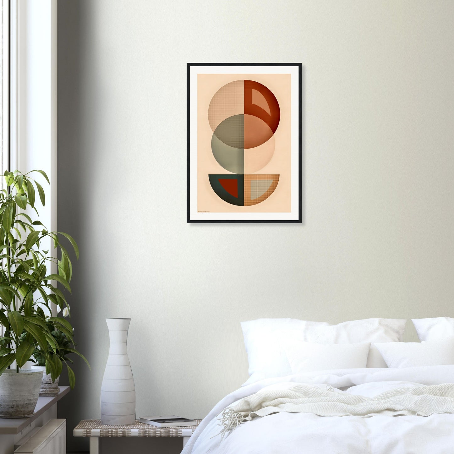 Abstract geometric earth tones framed poster above bed in calming bedroom setting