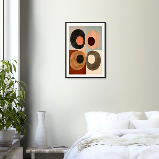 Framed abstract boho wall art printed on museum matte finish paper placed on a wall above a bed in a bedroom.