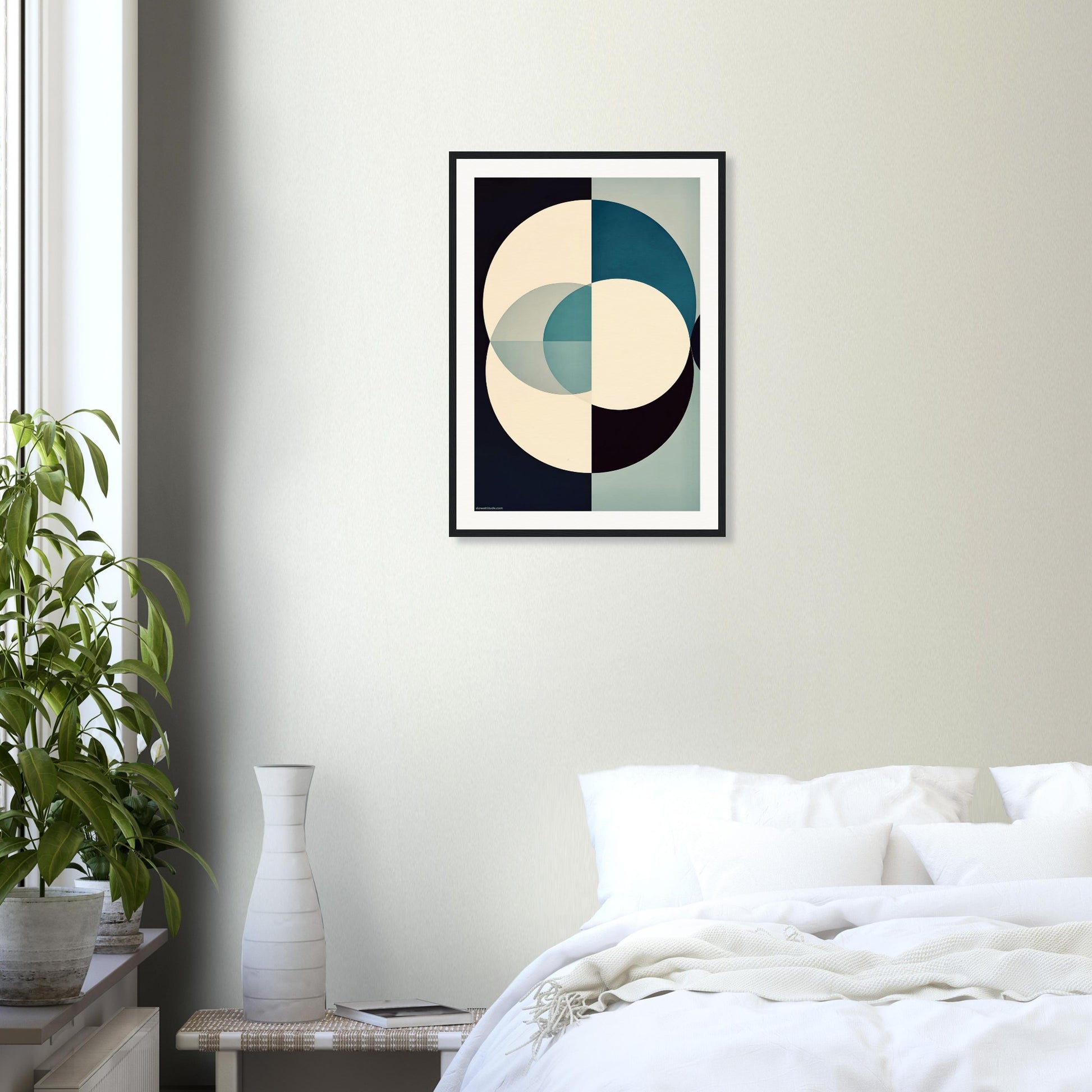 Framed calming abstract art piece on a wall above a bed in a bedroom.