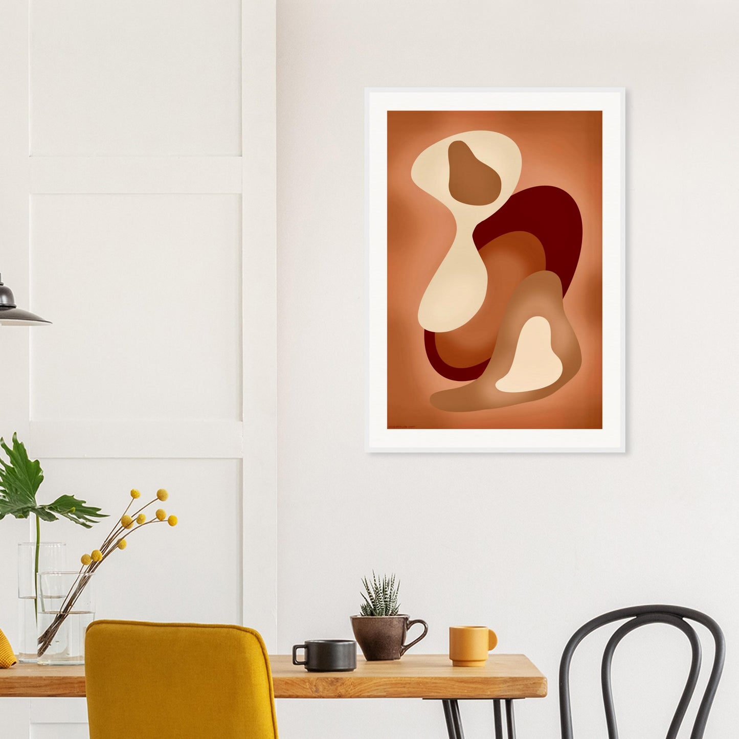 Calming abstract wall art in creative workspace with natural tones framed in a white frame